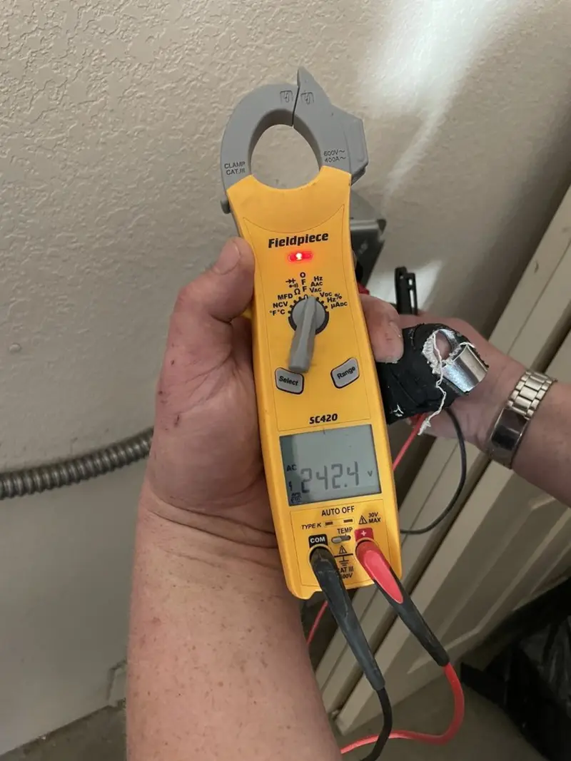 Voltage testing with clamp meter during Circuit Breaker Repair in Monument